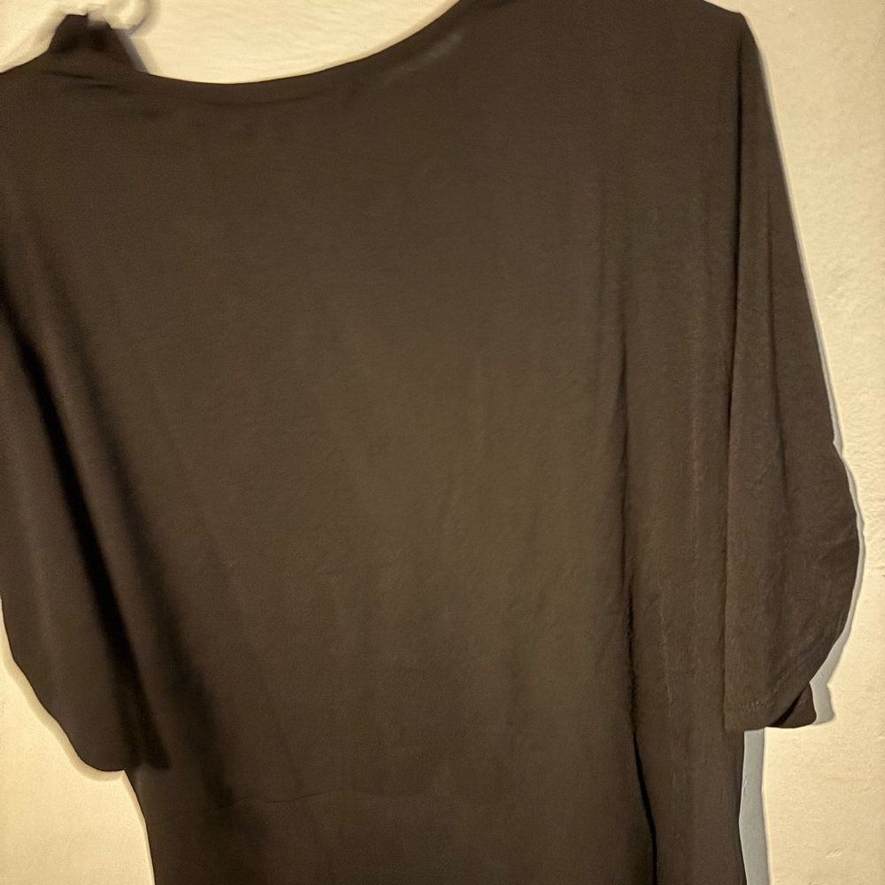 New with tag, black with silver rhinestone accents on the sleeves.